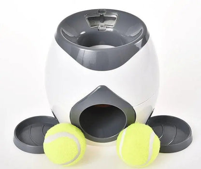 Purrfect Pet Kingdom automatic fetch machine for dogs with two yellow tennis balls and a gray and white launcher