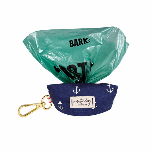 Cute pet waste bag dispenser for dogs in navy with anchor design and attached clip for easy carrying