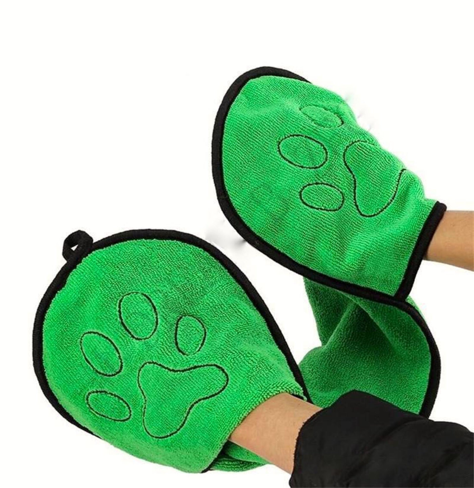 Green pet grooming mitts designed for gentle cleaning and care, featuring natural pet grooming products