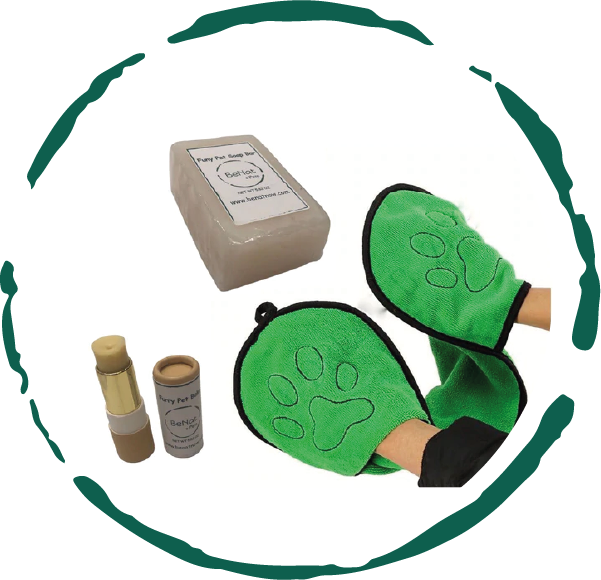 Natural pet grooming products including grooming gloves, soap bar, and deodorizing spray for dogs