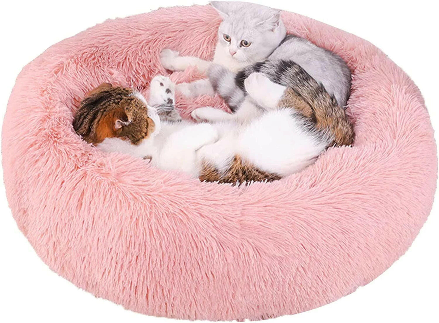 Soft pink calming pet bed for anxious dogs with fluffy design, perfect for providing comfort