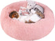 Soft pink calming pet bed for anxious dogs with fluffy design, perfect for providing comfort