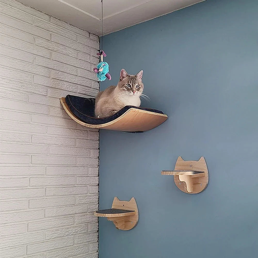 Tail Chasers cat climbing shelves for wall featuring a cozy hammock and playful wall mounts