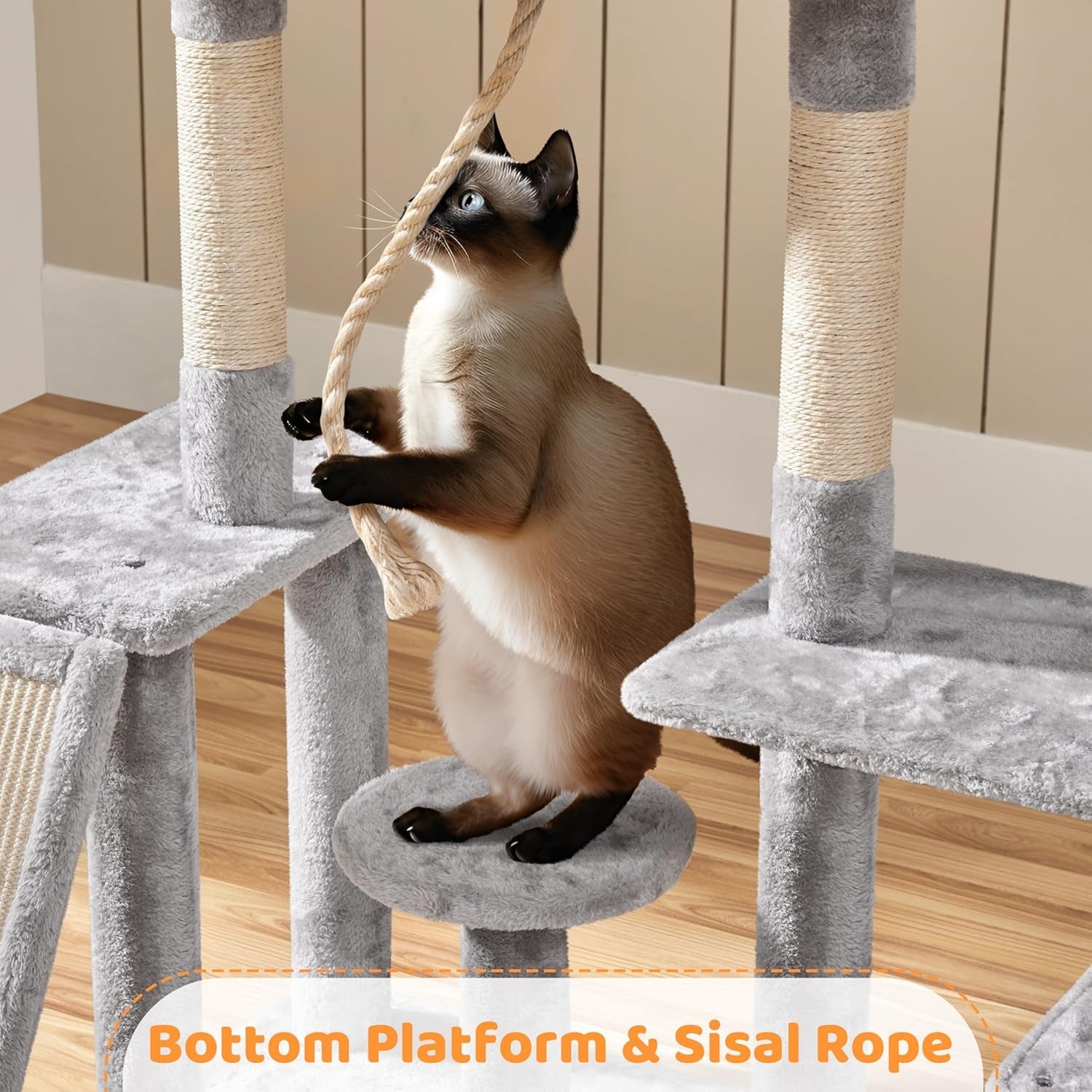 Siamese cat playfully climbing a Purrfect Pet Kingdom cat tree, ideal cat furniture for large cats