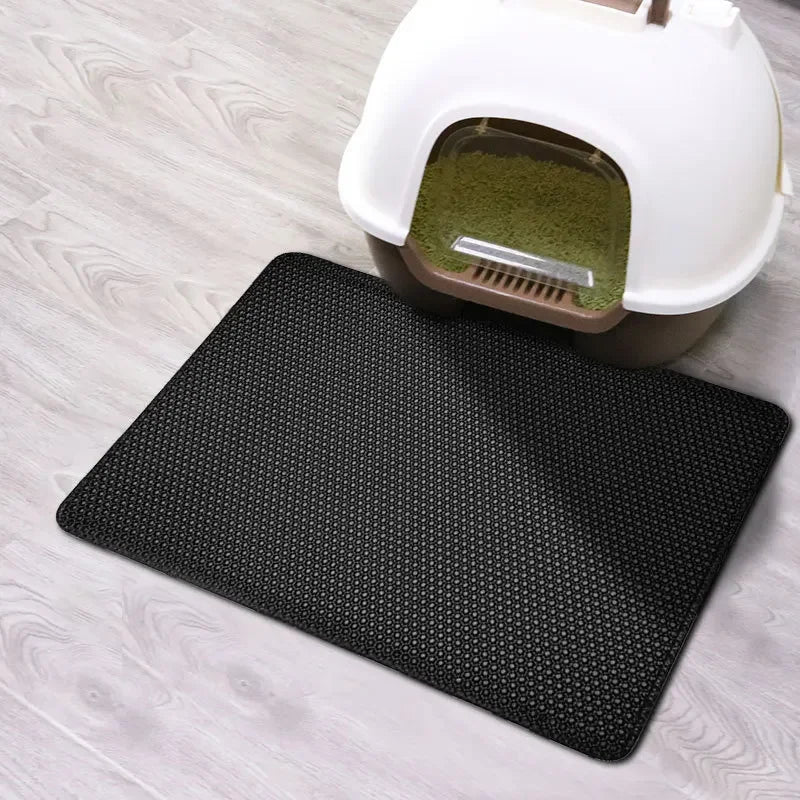 Tail Chasers Cat Litter Mat in black, designed as a cat litter pad for odor control near a litter box
