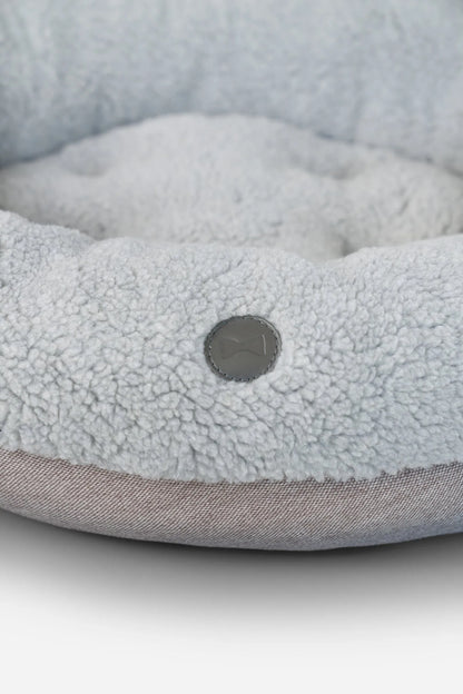 Furry gray donut dog bed by Chester & Lee, available in medium size, perfect for pets seeking luxury comfort.