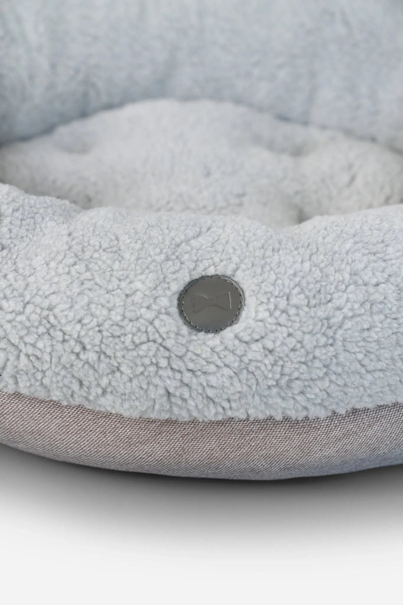 Furry gray donut dog bed by Chester & Lee, available in medium size, perfect for pets seeking luxury comfort.