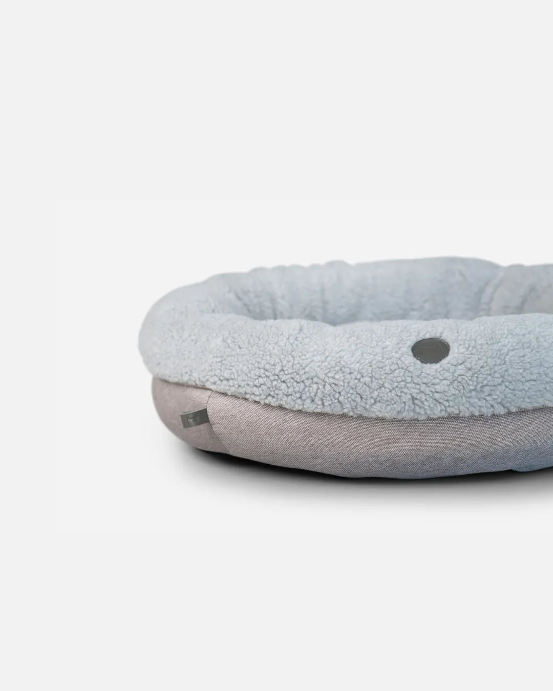 Furry gray donut dog bed by Chester & Lee, available in medium size, perfect for pets seeking luxury comfort.
