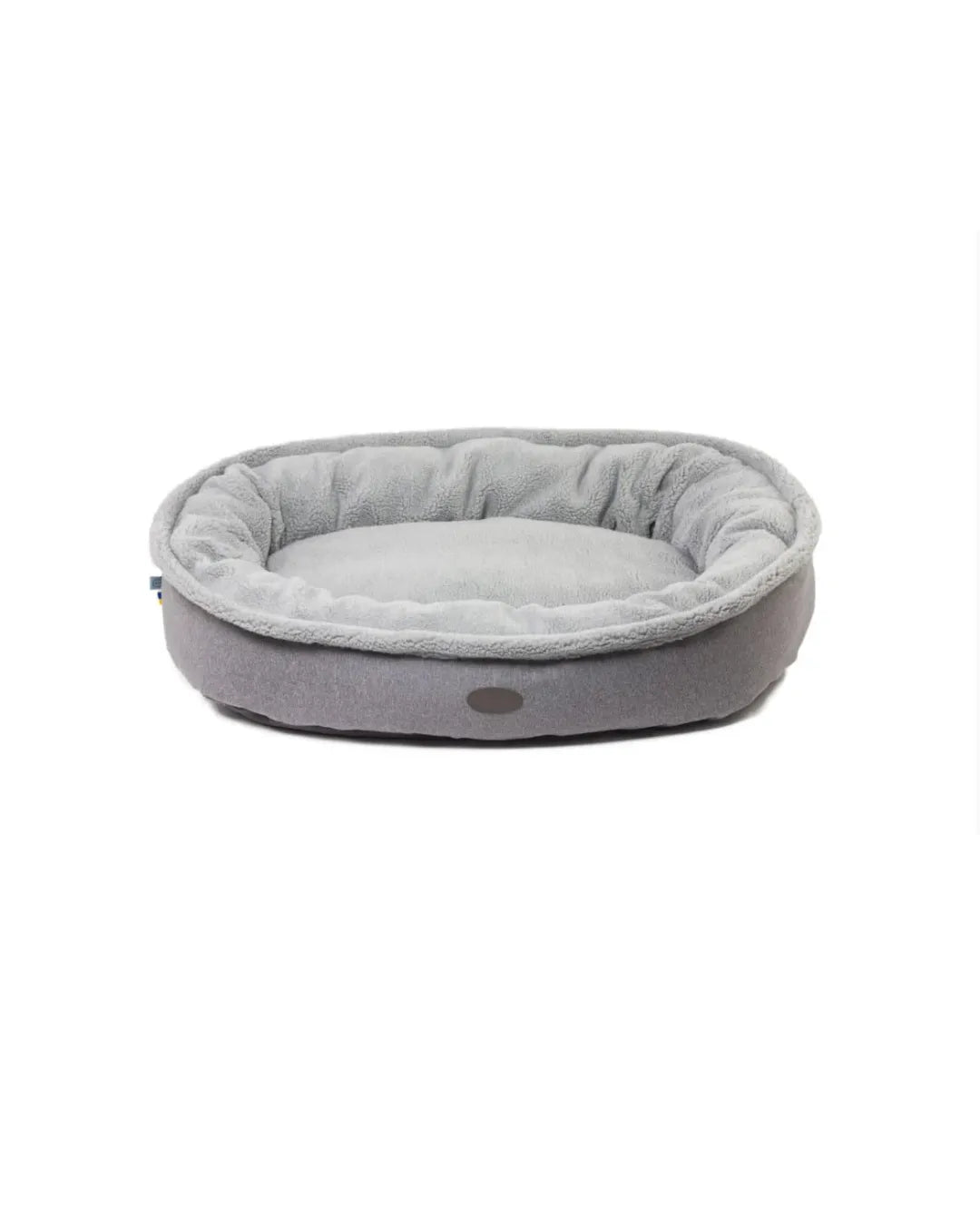 Chester & Lee Plush Furry Bagel Dog Bed in soft beige, available in L ($245) and XL ($295), perfect for calming comfort.