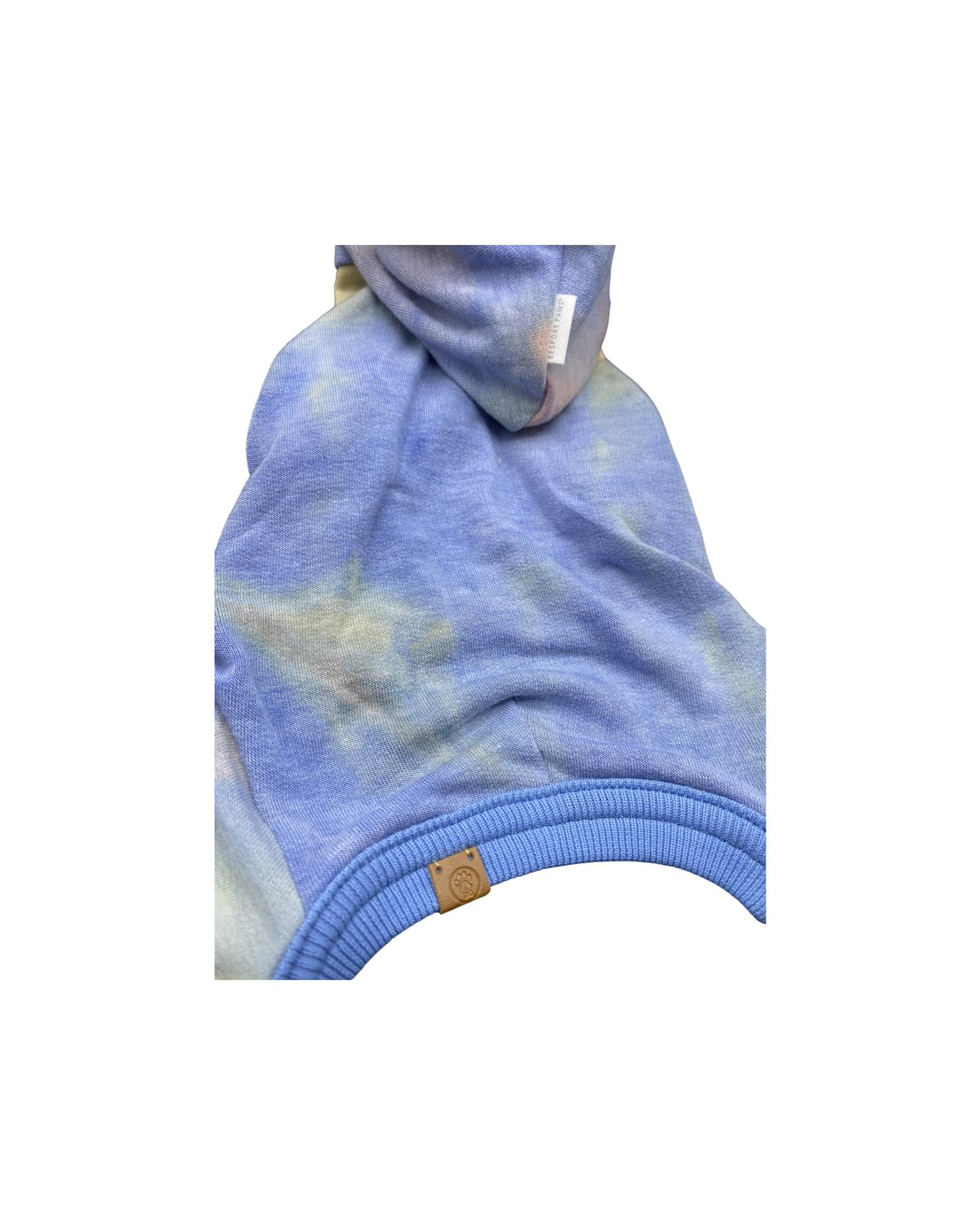 Colorful pet pajamas featuring a soft tie-dye design and cozy hood from BESPOKE PAWS