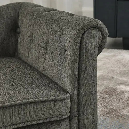 Comfortable raised dog bed for home with a stylish gray fabric design and tufted details