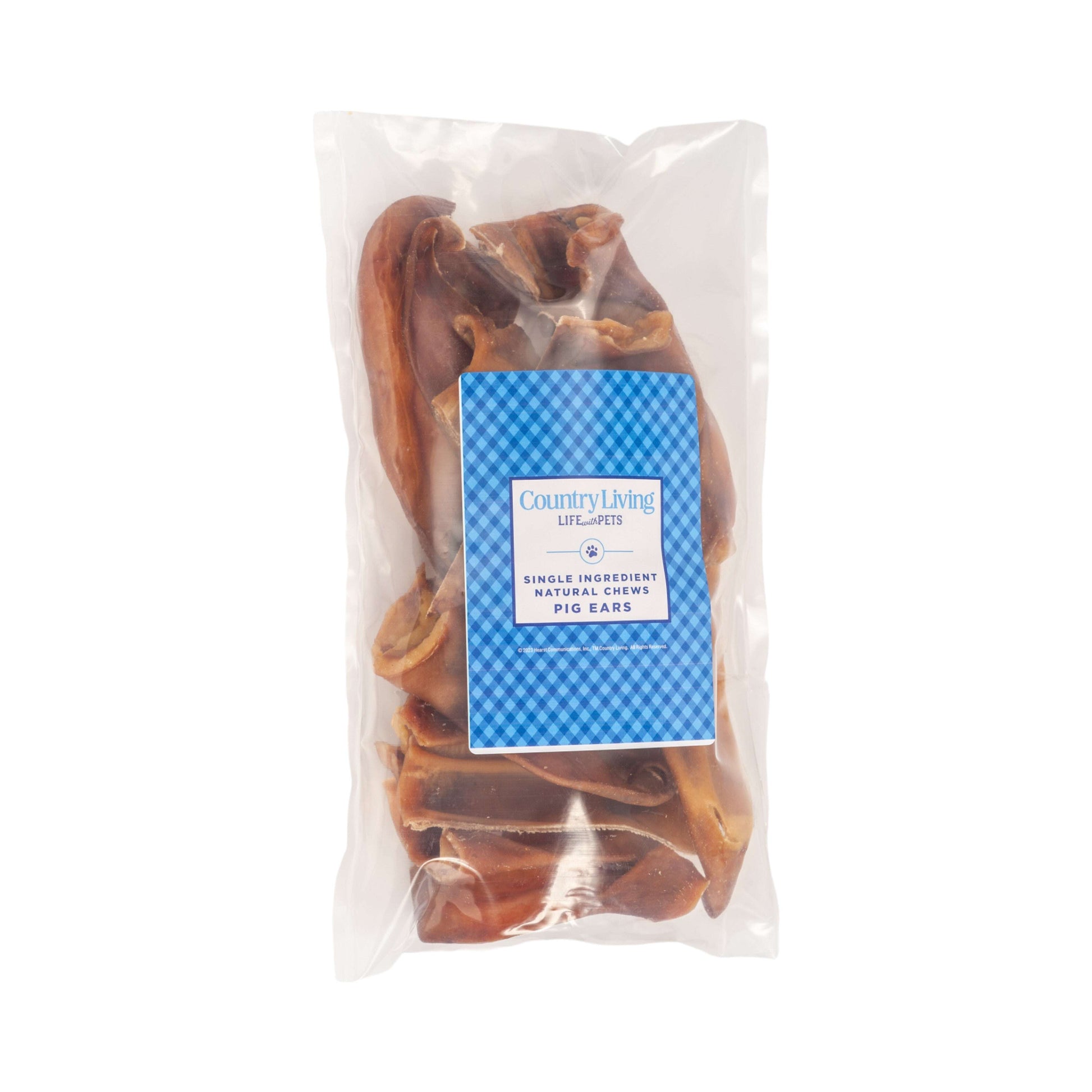Country Living premium pork chews for dogs in a clear package featuring pig ears