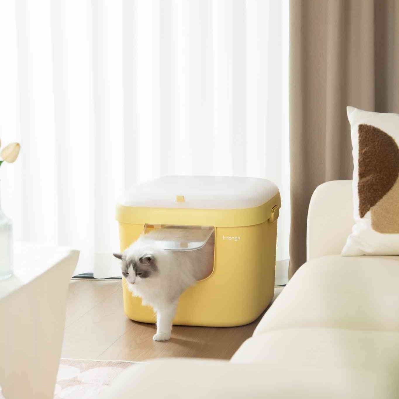 MangoPets covered litter box for multiple cats in yellow with a cat entering from the side
