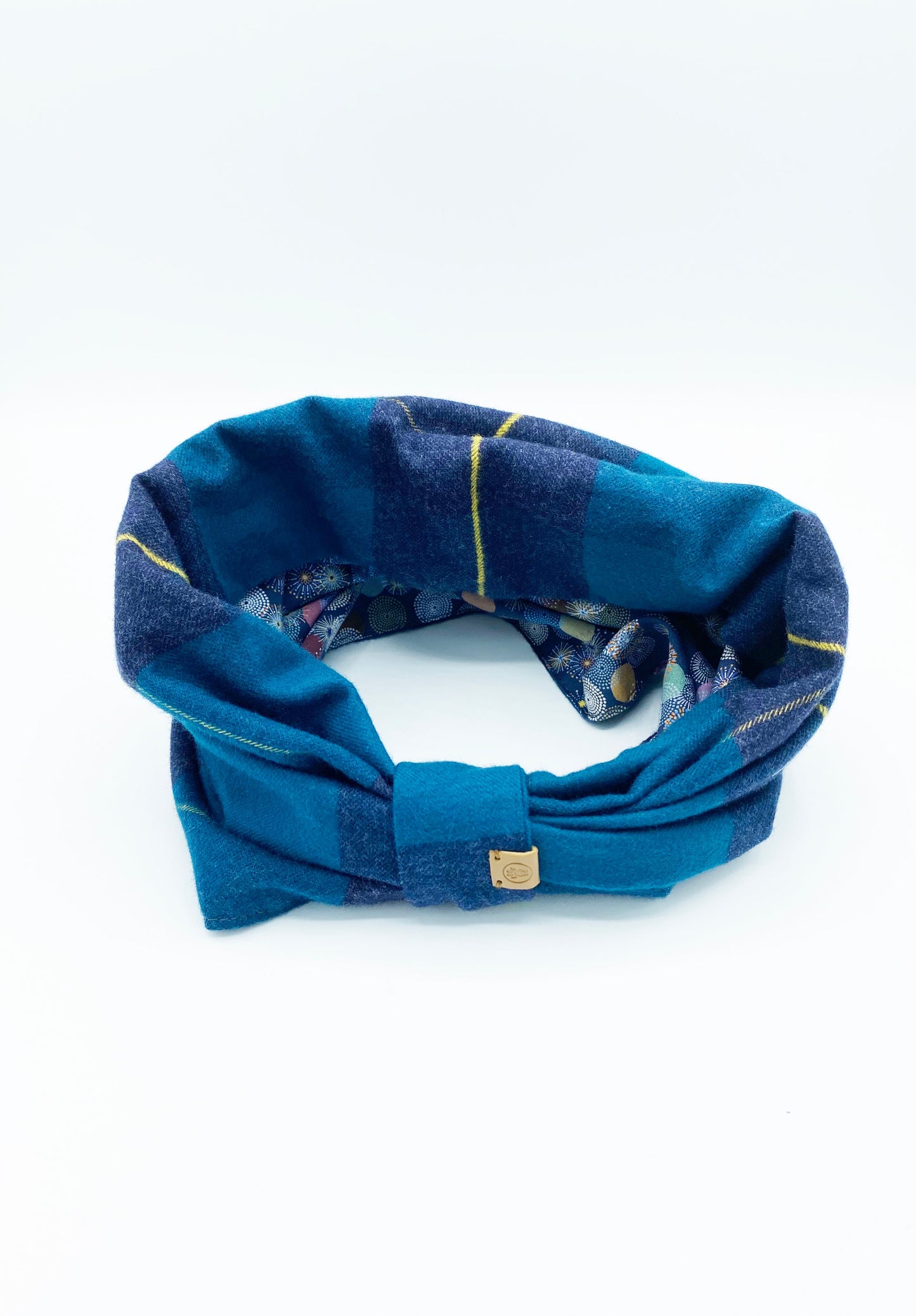 Cozy dog snood for winter in blue plaid design, perfect for keeping pets warm and stylish