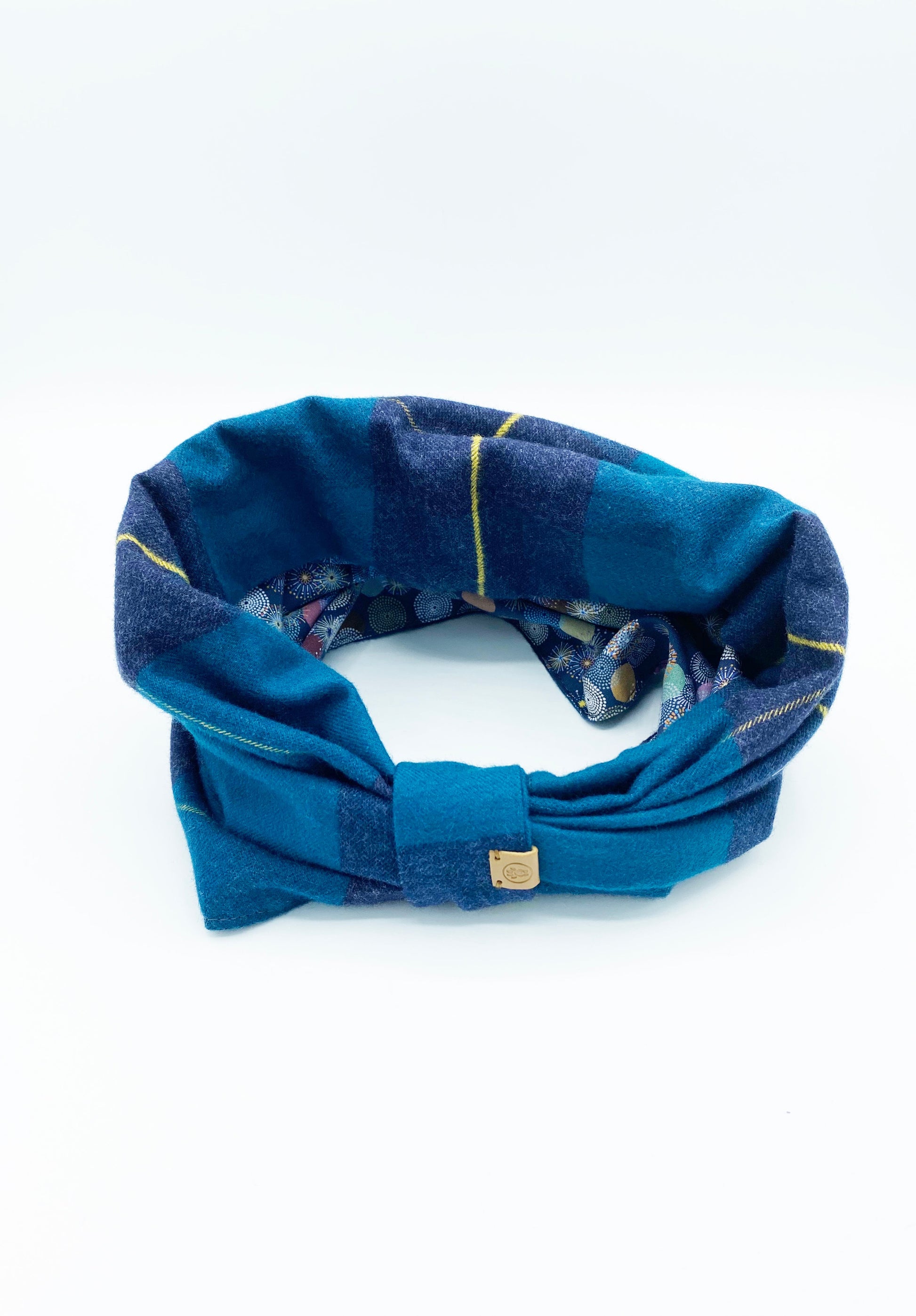 Cozy dog snood for winter in blue plaid design, perfect for keeping pets warm and stylish