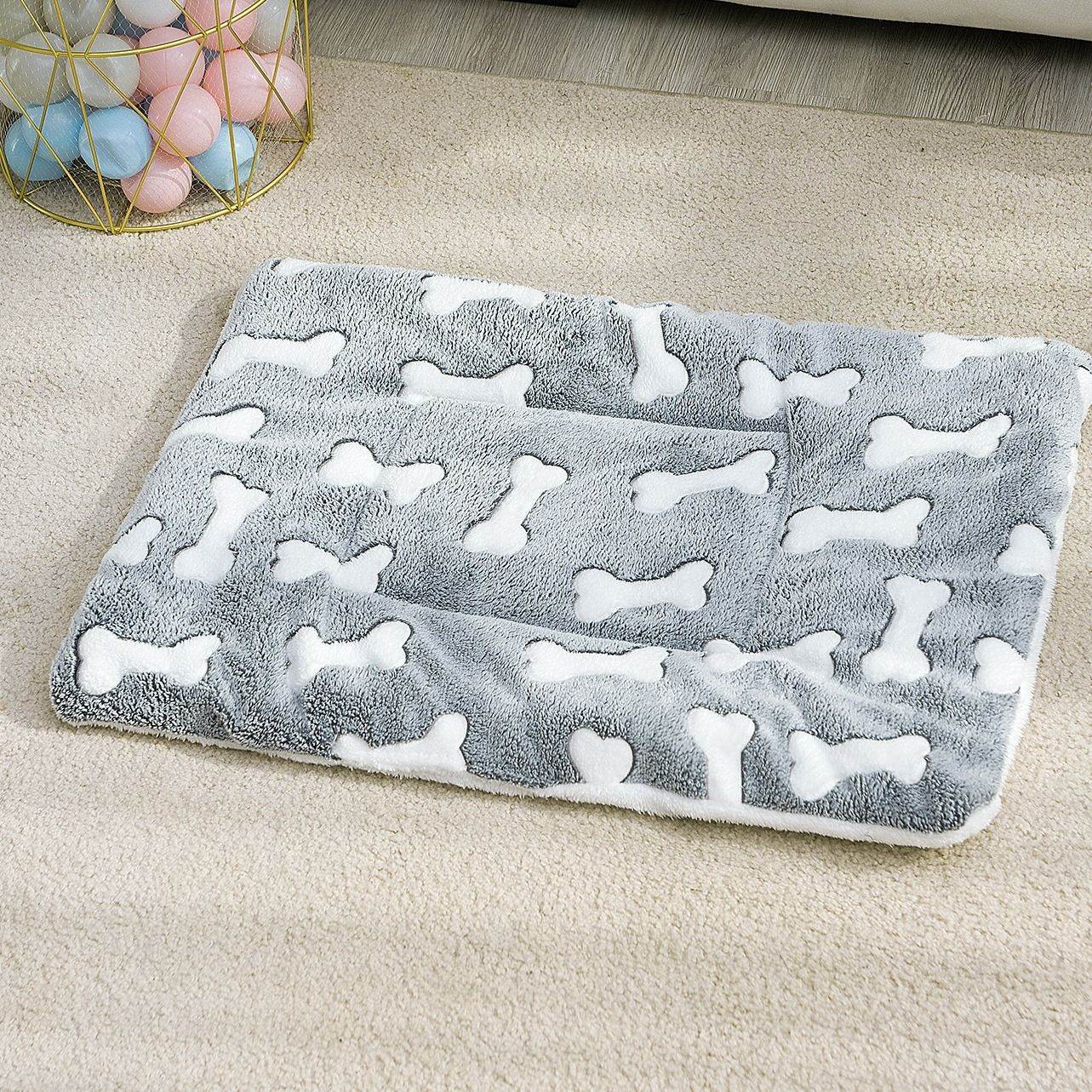 Cozy orthopedic pet sleeping pad in gray with white bone patterns by Purrfect Pet Kingdom