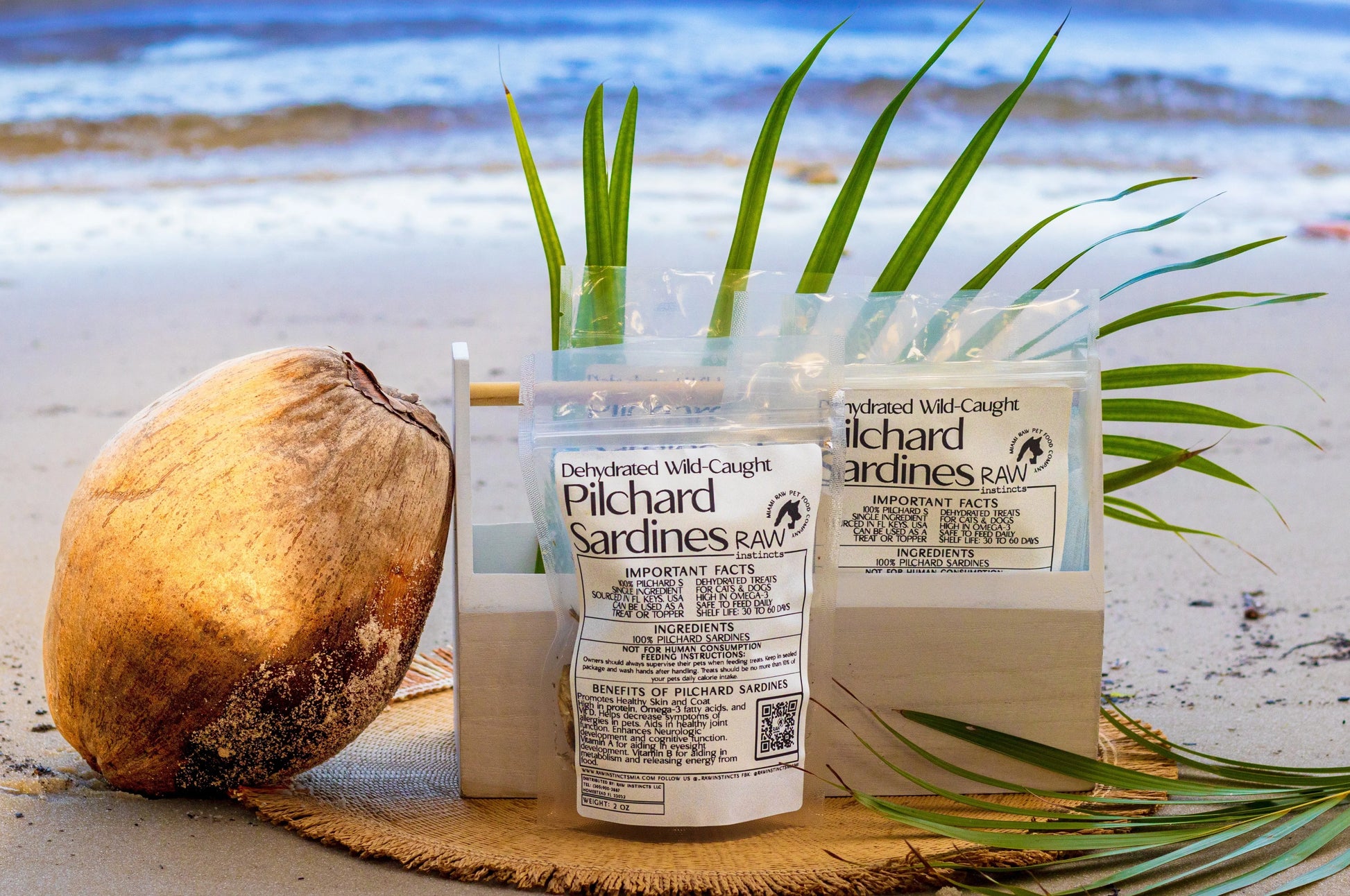 Dehydrated Wild Caught Pilchard Sardines for Cats and Dogs by Raw Instincts, 2 oz package, featuring natural seafood treats.