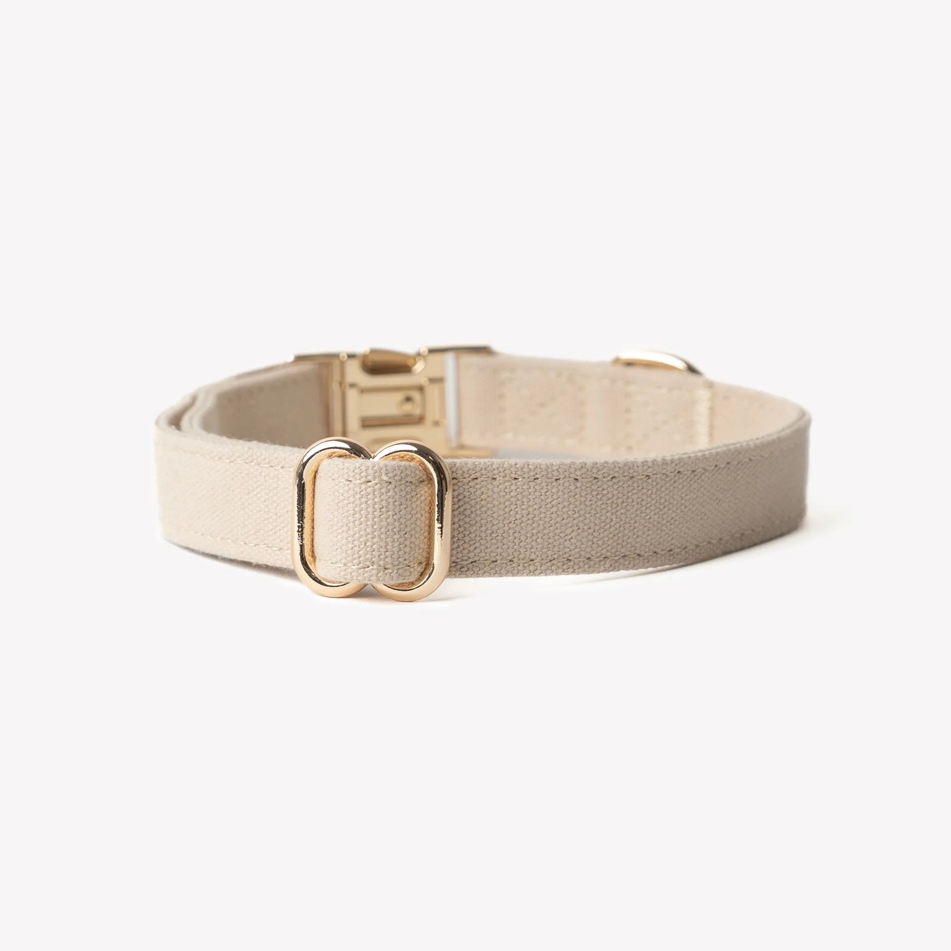 Tan adjustable dog collar made of soft cotton by Purrfect Pet Kingdom, available in small, medium, and large sizes.