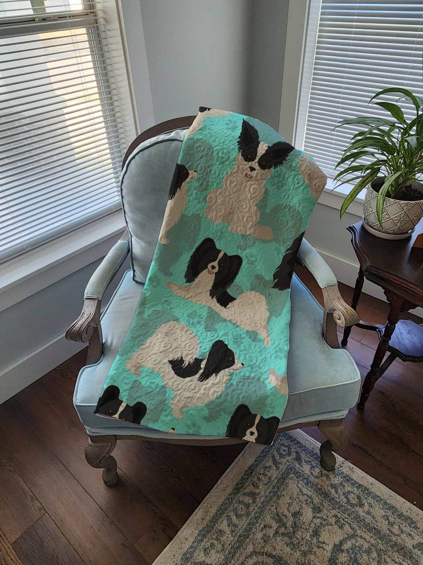 Royal Comfort dog lover gift blanket 50x60 with black and white dog pattern draped over blue armchair