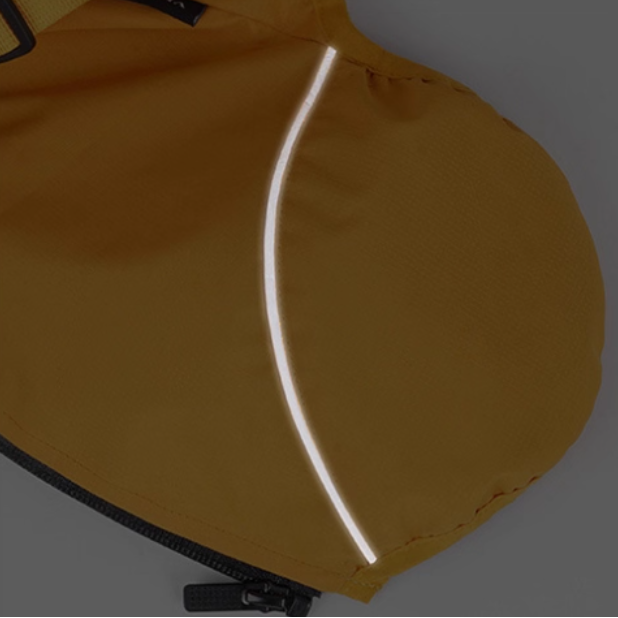 Close-up of dog waterproof reflective jacket with bright reflective strip for visibility in rain