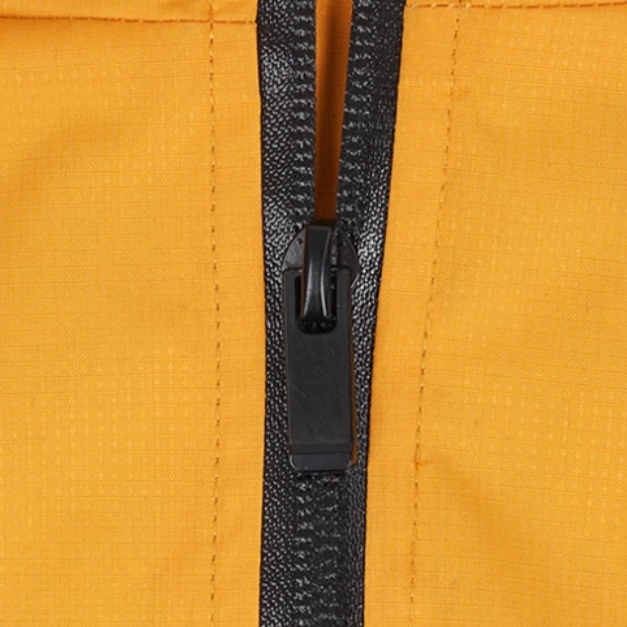 Close-up of yellow zipper on a dog waterproof reflective jacket for rainy days