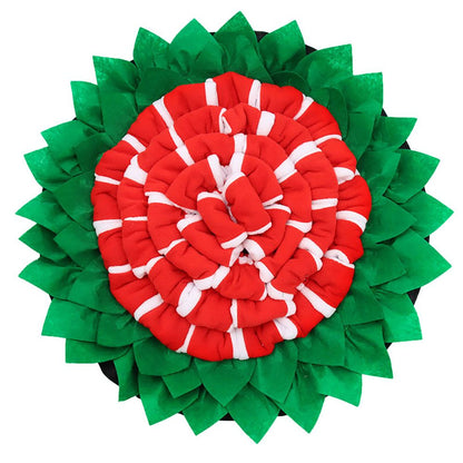 Purrfect Pet Kingdom dog enrichment feeding mat designed with red and white fabric layers surrounded by green leaf-like fabric for snuffle and play