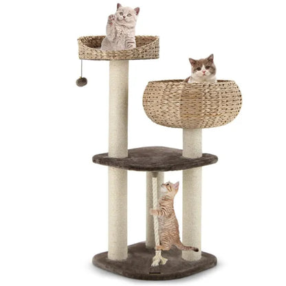 Three kittens playing on a 3-level brown water hyacinth cat tree with woven baskets and sisal scratching posts.