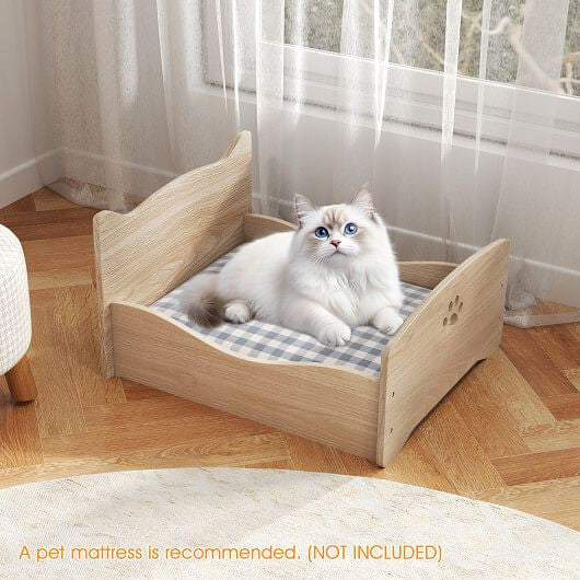 Elevated cat bed with frame in natural wood finish providing a cozy resting spot for cats