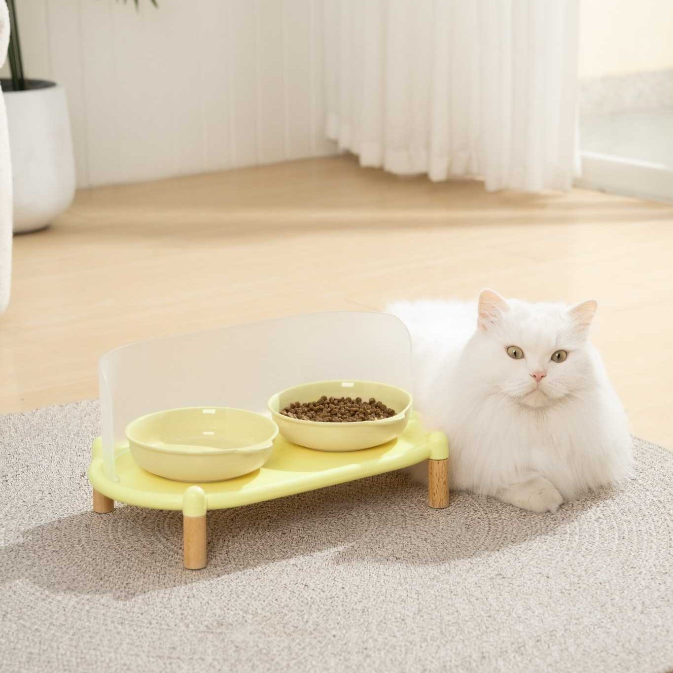 MangoPets elevated cat dining table in yellow with two bowls for comfortable feeding