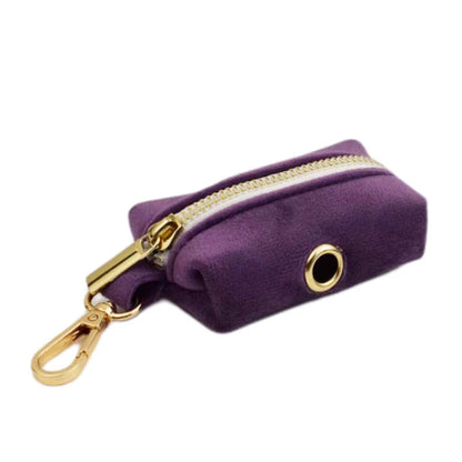 Purrfect Pet Kingdom purple velvet dog waste bag pouch with gold zipper, swivel clasp, and grommet.