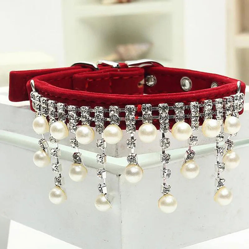 Red stylish dog collar with pearl and crystal embellishments, a fancy cat collar for special occasions