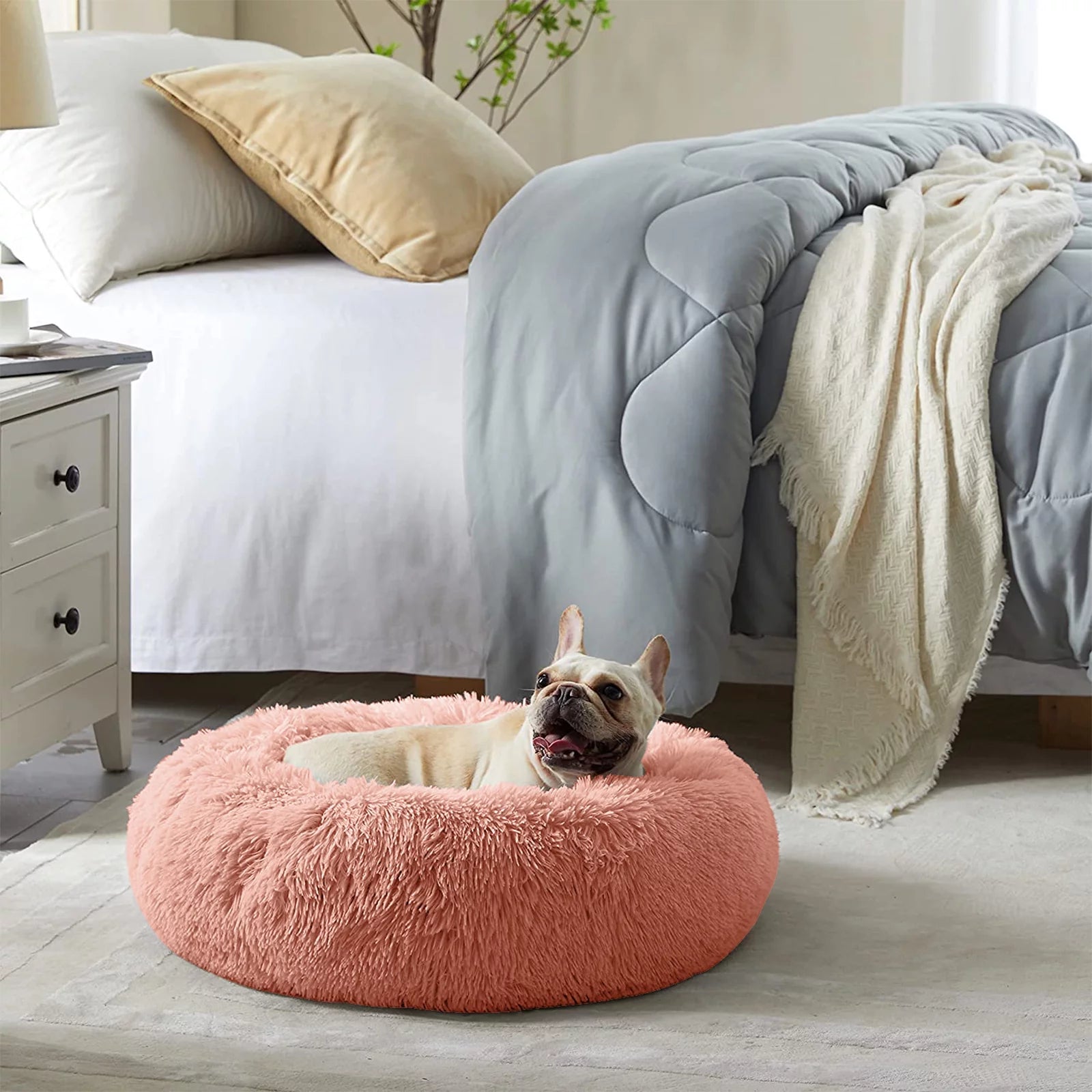 Fluffy donut cat bed in pink with a cozy design, perfect for pets to snuggle and rest comfortably