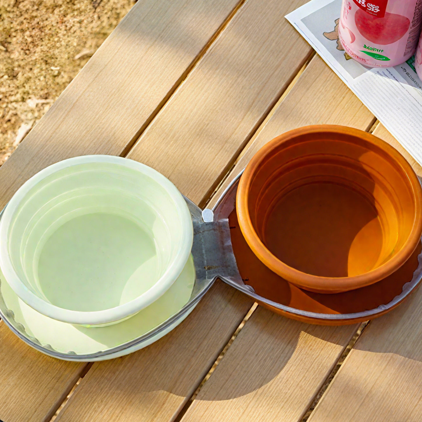 Two foldable pet travel bowls in green and brown, perfect for on-the-go hydration for pets