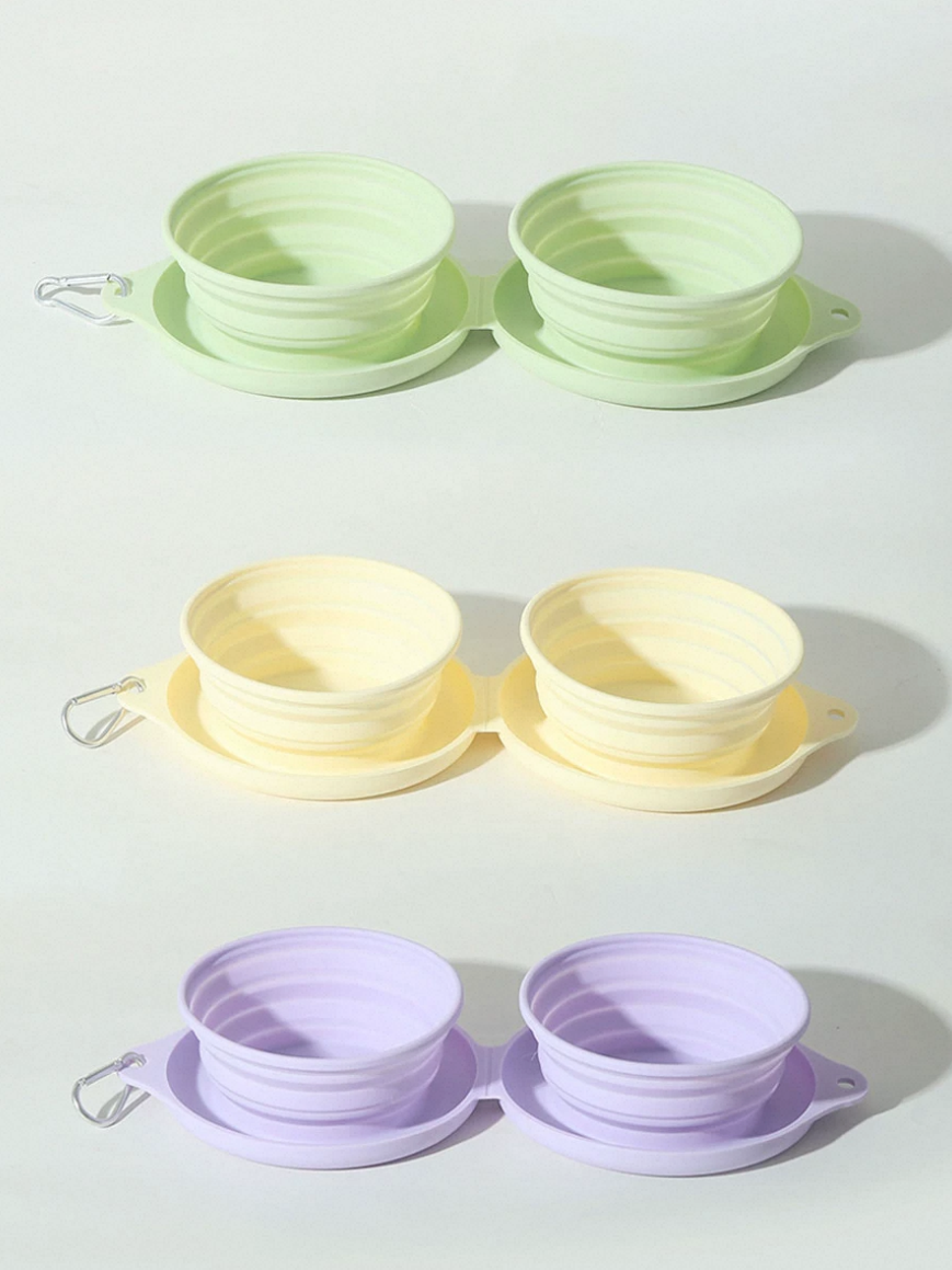 Set of foldable pet travel bowls in green, yellow, and purple for easy feeding on the go