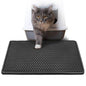 Purrfect Pet Kingdom cat litter scatter control mat with textured surface and gray cat stepping out of litter box