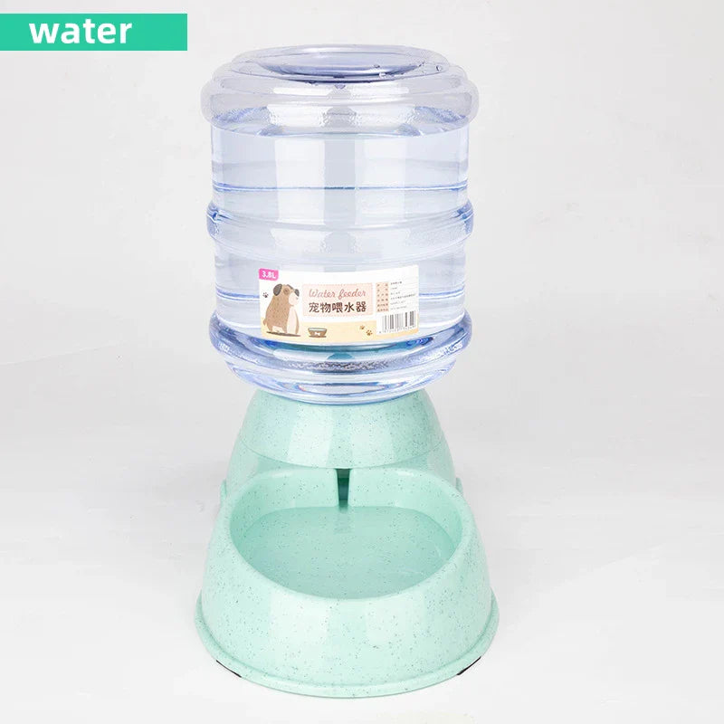 Gravity pet water and food dispenser with large water reservoir and green base for easy feeding