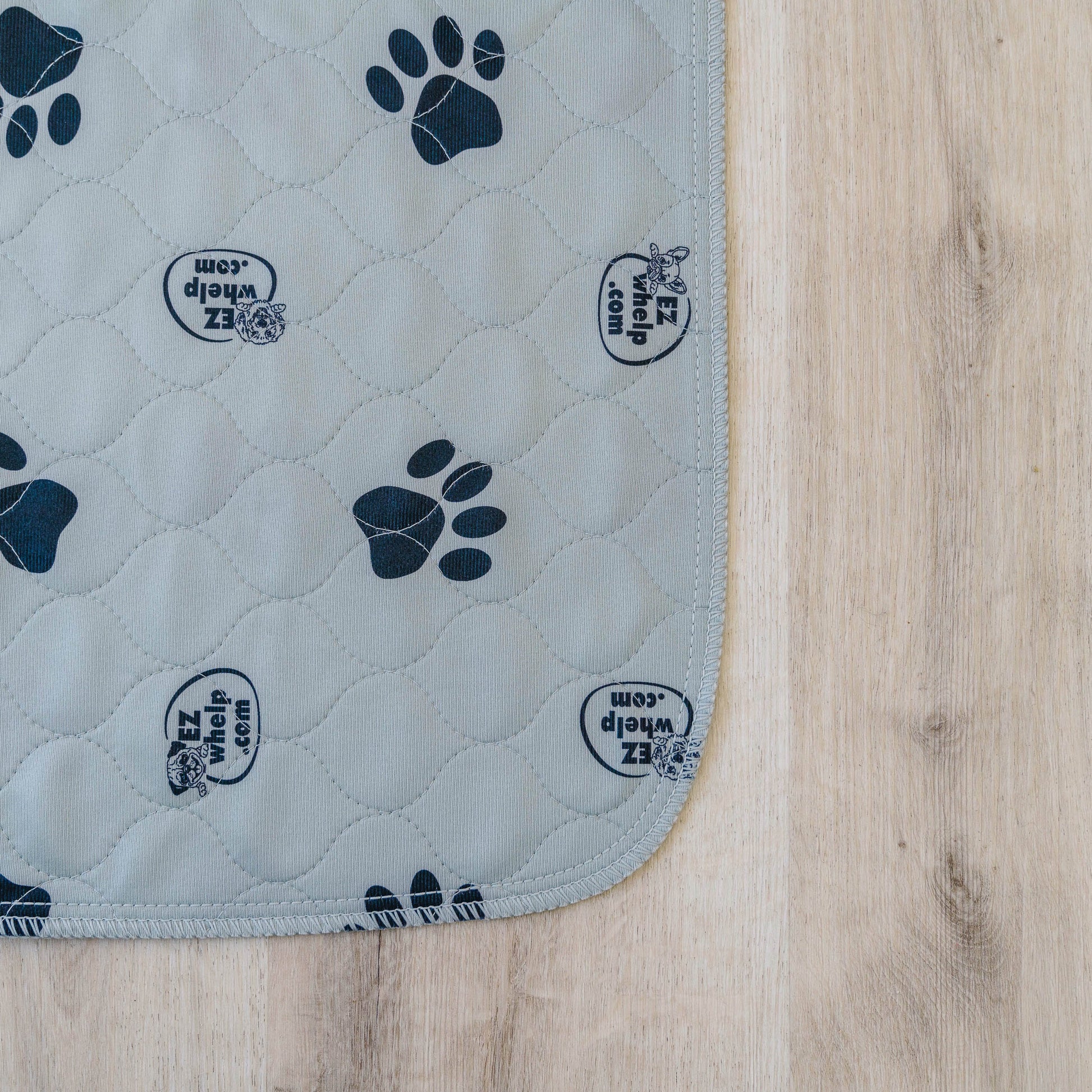 EZwhelp gray paw print pet mat designed for comfort and warmth in dog crates
