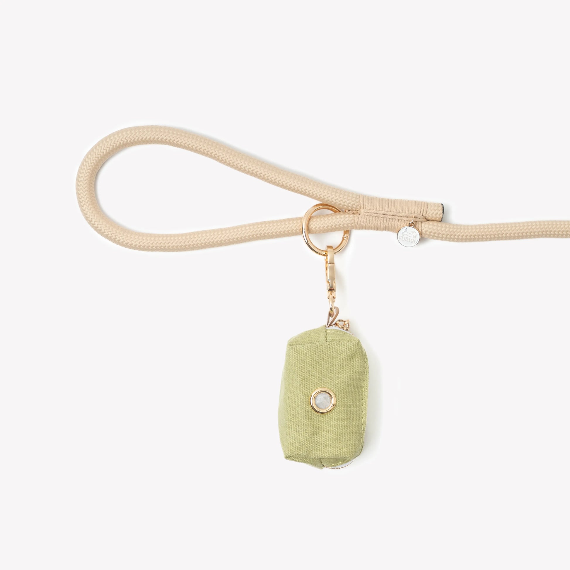 Green poop bag holder by Purrfect Pet Kingdom, perfect for pet owners, featuring a compact design for easy dispensing.