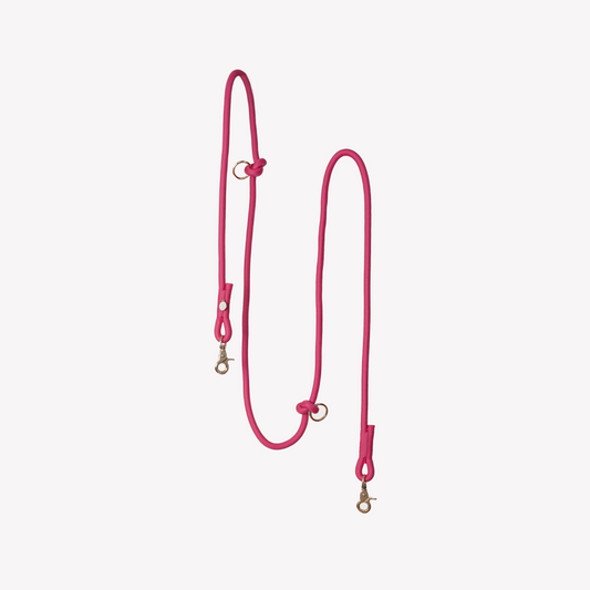 FURLOU Hands Free Dog Leash in bright pink, designed for comfortable walking and jogging with your pet