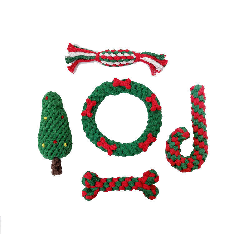 Holiday pet gifts for dogs, featuring colorful rope toys shaped like a tree, wreath, candy cane, and bones
