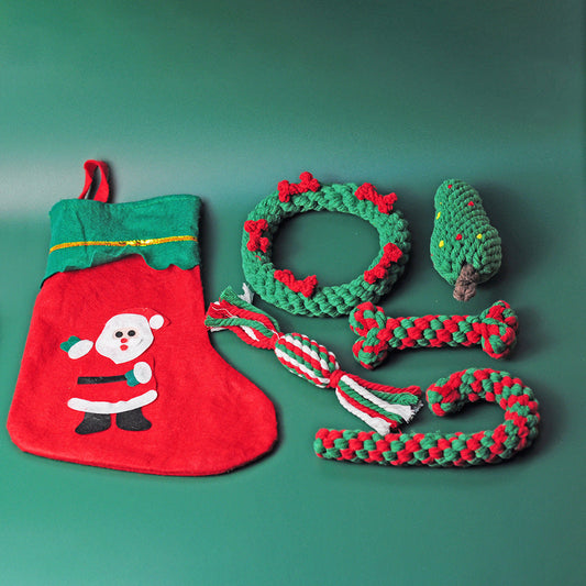 Festive holiday pet gifts for dogs including toys and a plush stocking