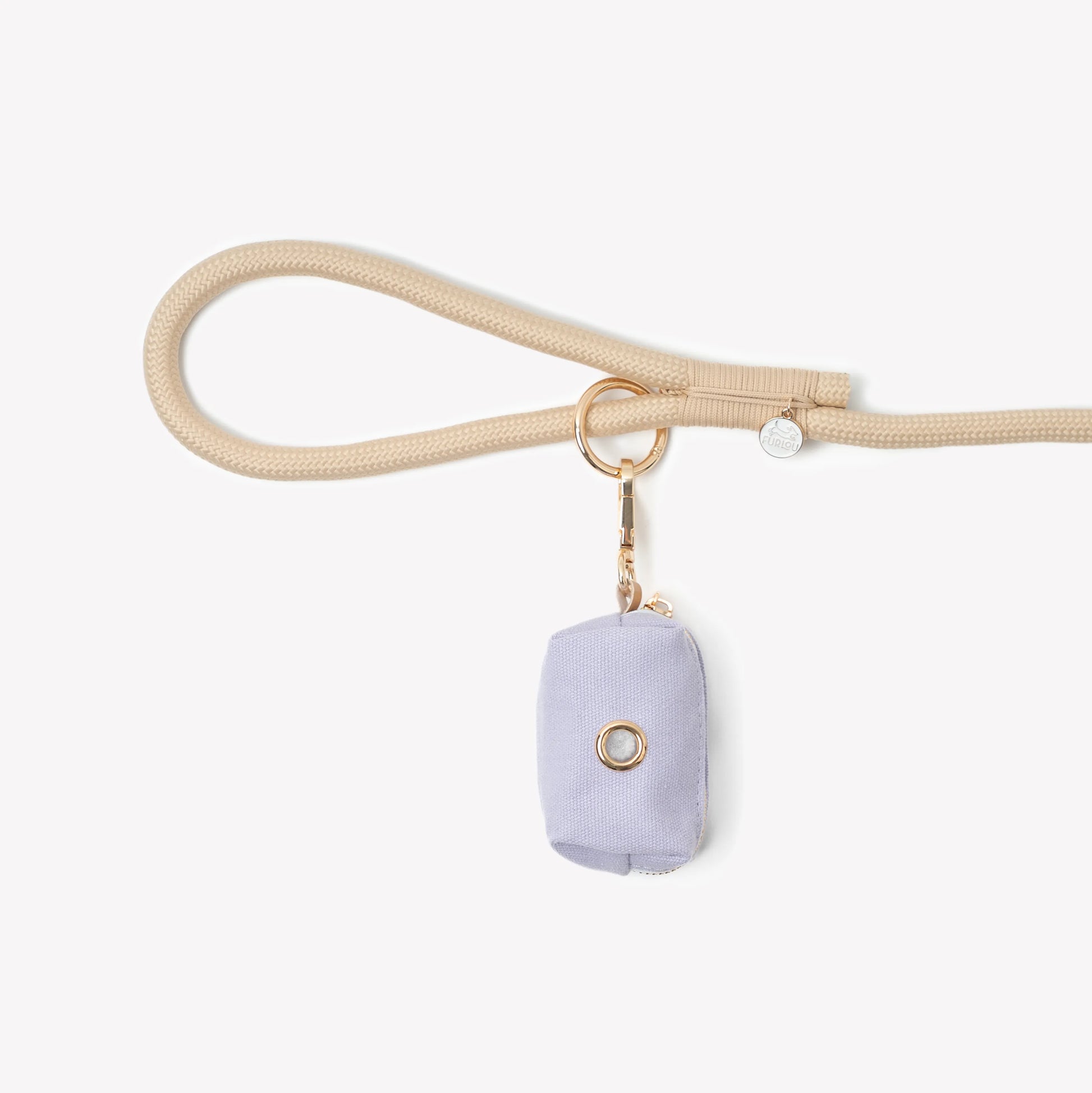Lavender FURLOU poop bag holder and dispenser in a compact design, perfect for pet owners on the go.