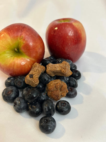 Lucy Loo Treats Apple & Blueberry dog treats in a 7.5 oz bag, featuring chewy and crunchy variants, perfect for pampering ...