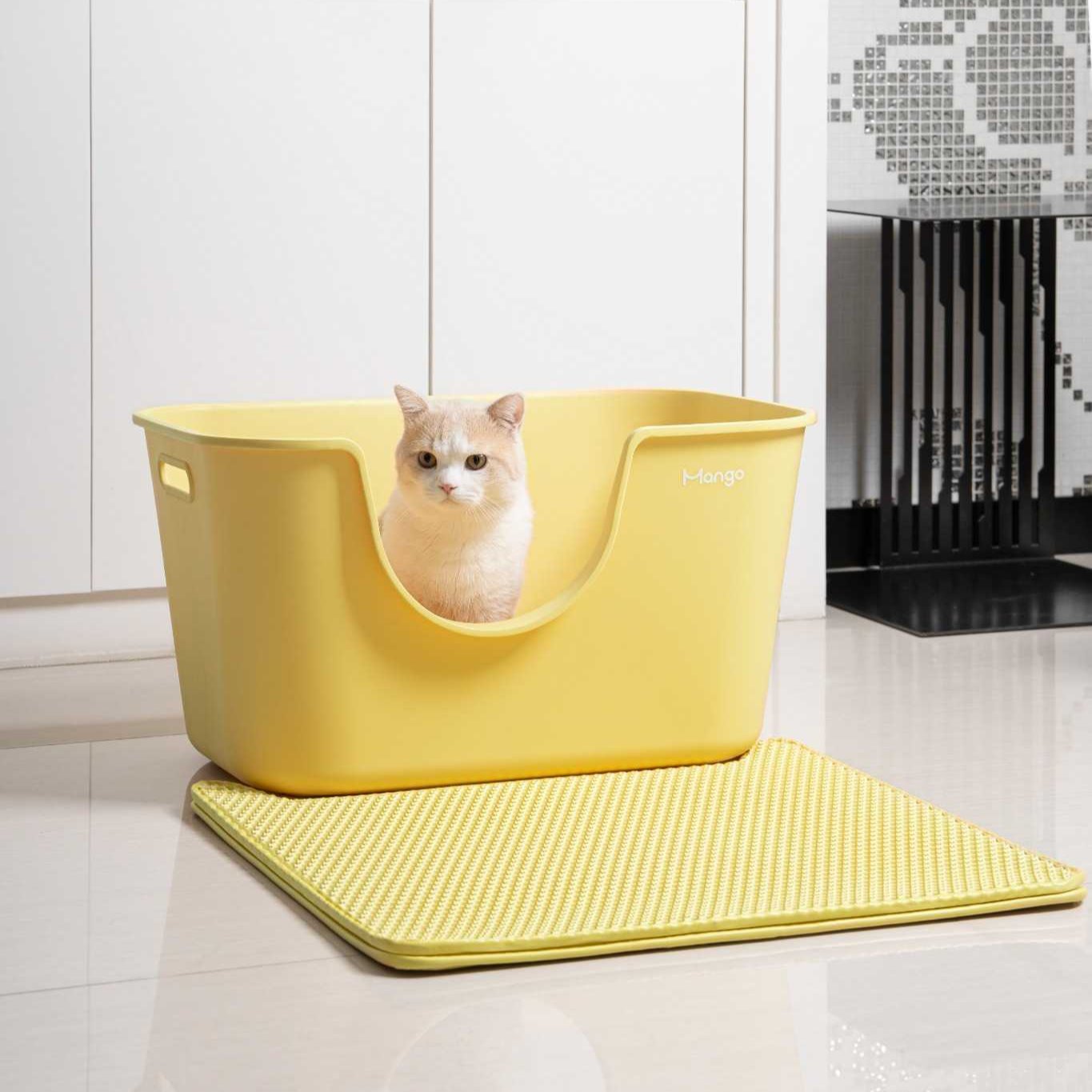 Butter colored litter box for cats by MangoPets with a cozy design and a cat sitting inside