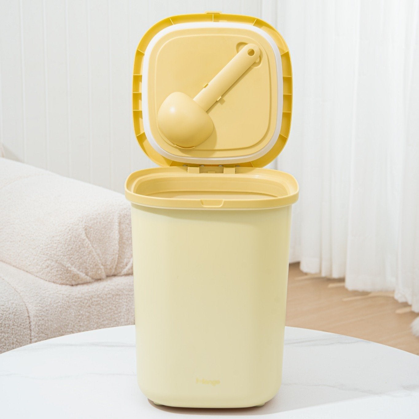 MangoPets large capacity dog food container in yellow with a measuring scoop and airtight lid
