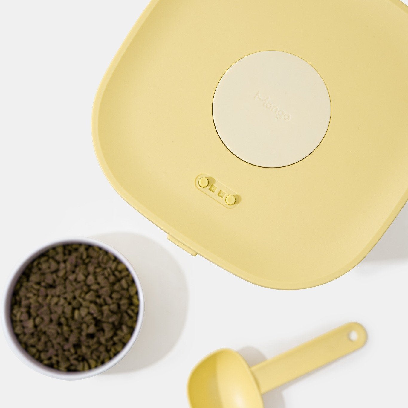 MangoPets large capacity dog food container in yellow with a scoop and a bowl of dog food