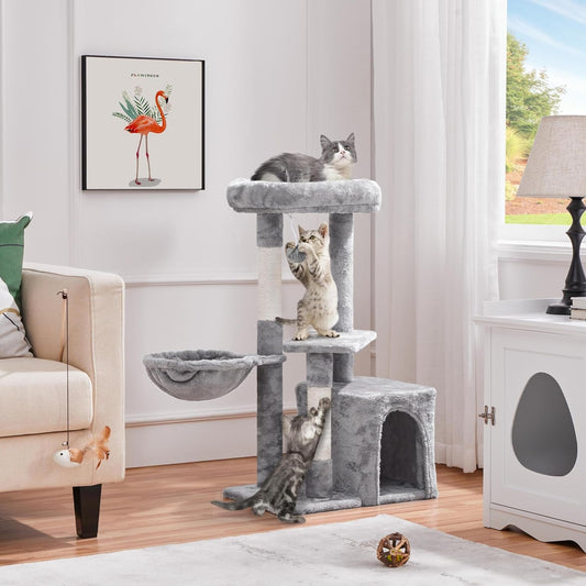 Purrfect Pet Kingdom multi-level cat furniture with three playful cats climbing and lounging