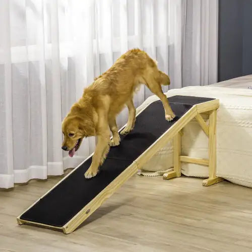 Non-slip dog ramp for bed designed for easy access and safety for pets.