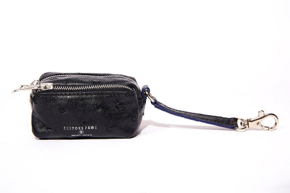 Black textured ostrich leather BESPOKE PAWS dog poop bag dispenser with silver zippers and lobster clasp.