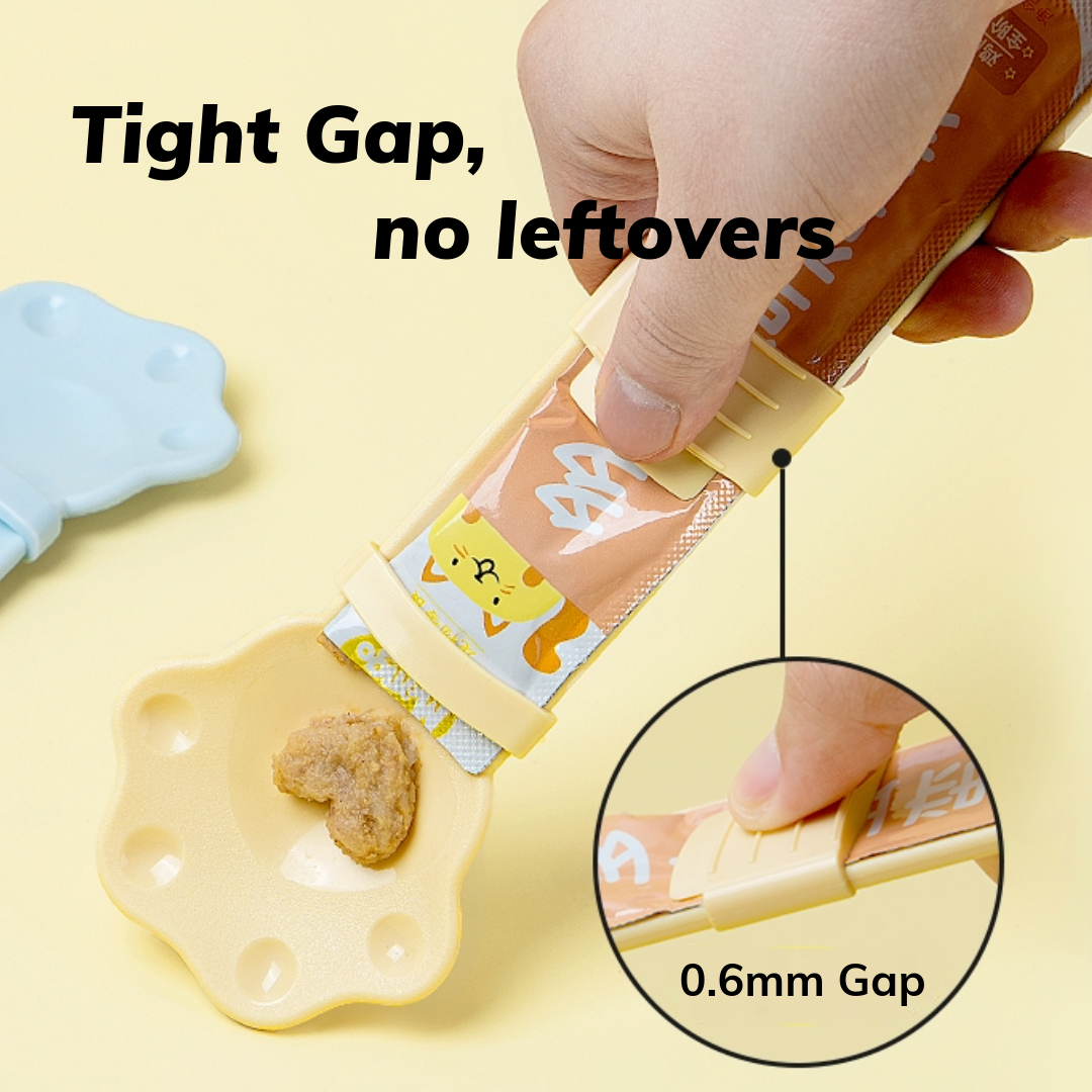 MangoPets paw shaped cat treat spoon with a tight gap design for no leftovers during treat dispensing